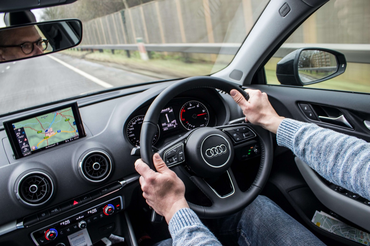person driving car inside view